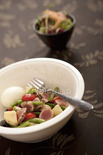 Ham salad on white plate with fork — Stock Photo