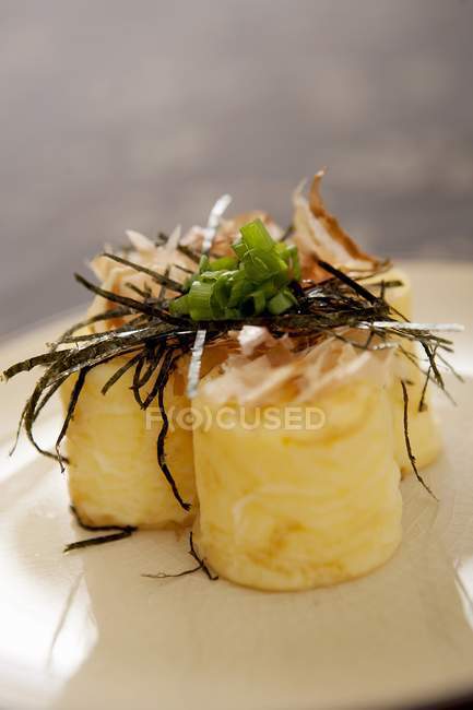 Japanese tofu with herbs on white plate — Stock Photo
