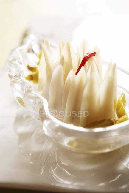 Closeup view of duck gristles with vegetables in glass bowl — Stock Photo