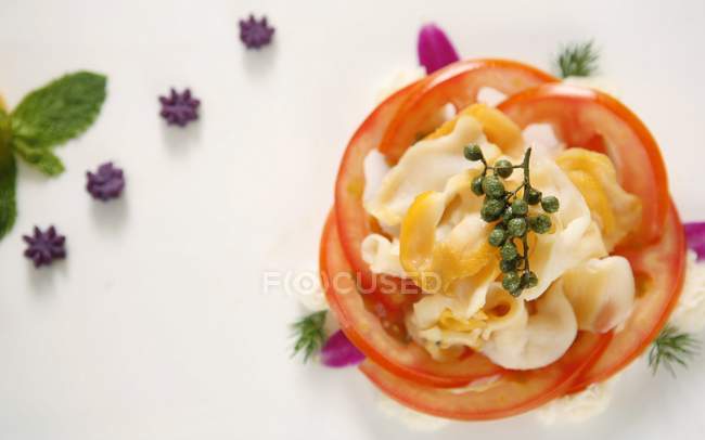 Closeup top view of fried cod fillet with vegetables and herbs — Stock Photo