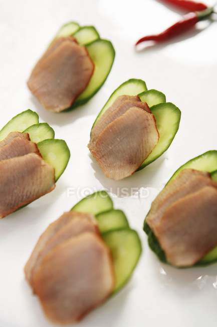 Closeup view of sliced duck meat with cucumbers — Stock Photo