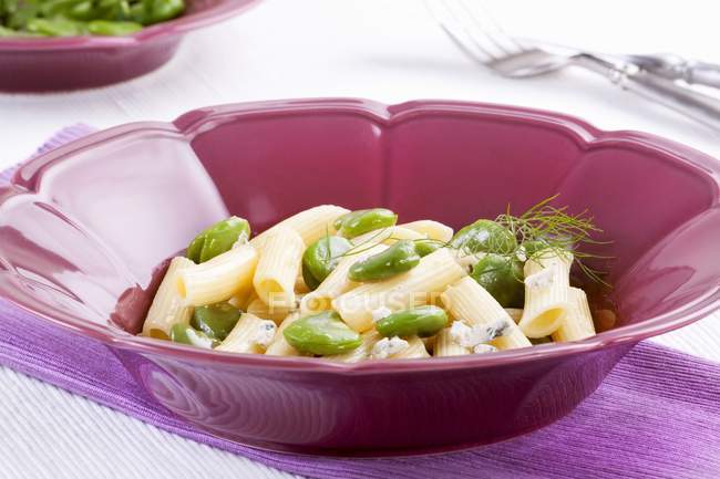 Penne pasta with broad beans — Stock Photo