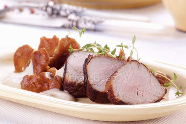 Pork fillet with chanterelle mushrooms — Stock Photo