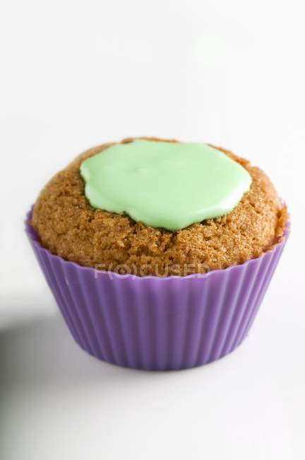 Cupcake with green icing — Stock Photo