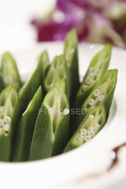 Crisp cucumber on white plate — Stock Photo