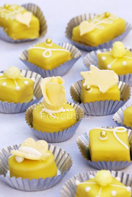 Petit fours with marzipan decorations — Stock Photo