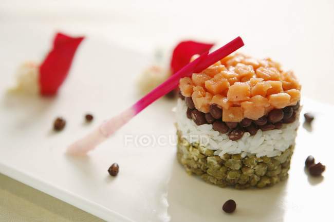 Stack of diced salmon and rice — Stock Photo