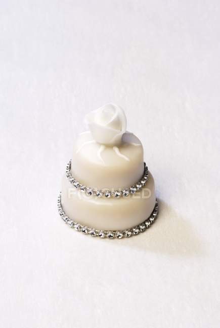Two-tiered petit four with rose — Stock Photo