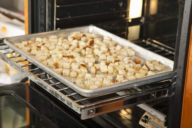 Croutons Baking in Oven — Stock Photo