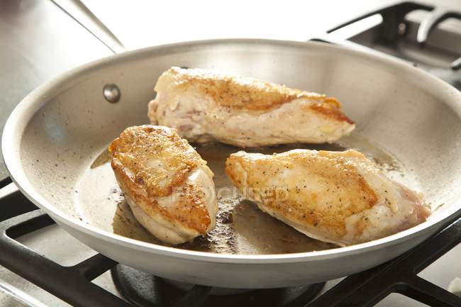Browning Chicken Breasts — Stock Photo