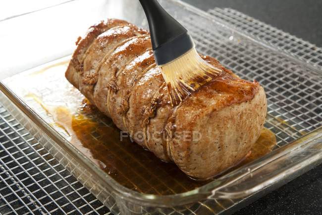 Brushing Pork Loin with Glaze — Stock Photo