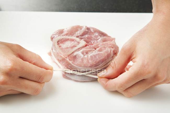 Hands Making Osso Bucco — Stock Photo
