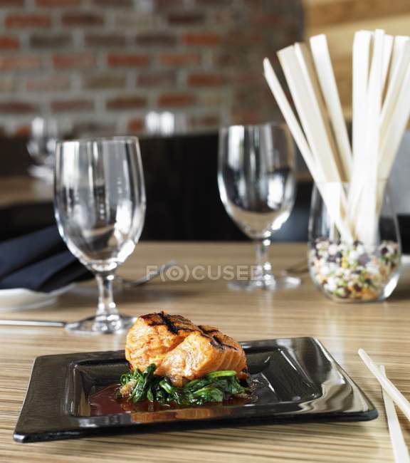 Grilled salmon fillet with greens — Stock Photo
