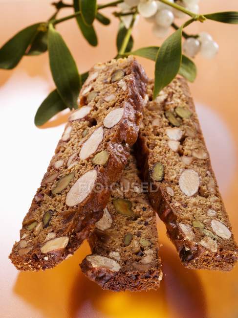 Closeup view of Panforte slices with nuts and white currant branch — Stock Photo