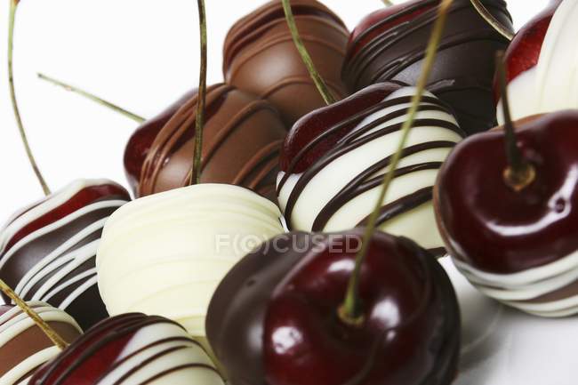 Chocolate-coated cherries — Stock Photo