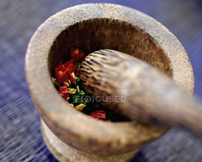 Ingredients for chilli paste in a mortar — Stock Photo