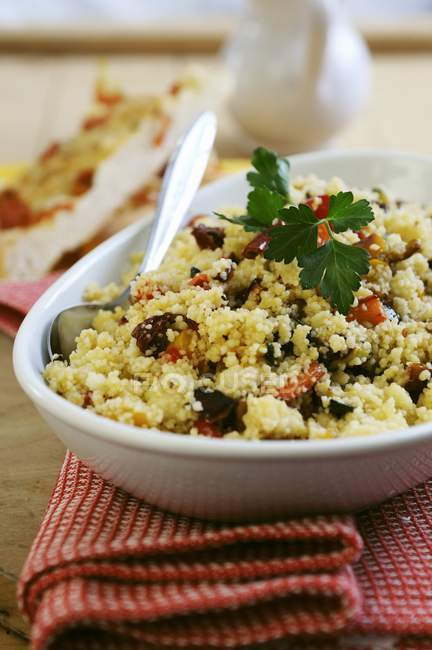 Couscous with dried tomatoes, peppers and courgette — Stock Photo