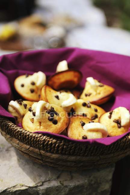 Chocolate chip muffins decorated with banana — Stock Photo