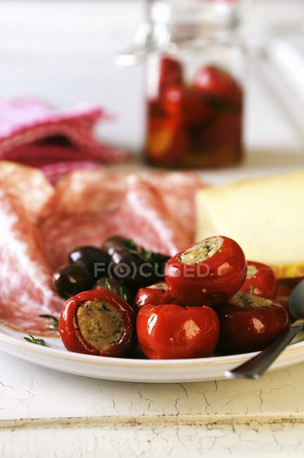 Antipasti platter with peppers — Stock Photo