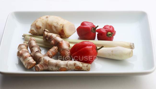 Turmeric roots and chili Peppers — Stock Photo