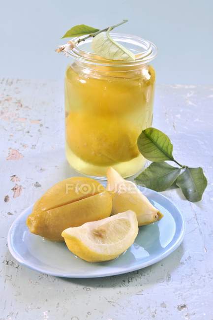 Pickled lemons in jar — Stock Photo