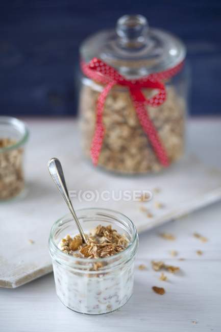 Granola and yogurt in small jar — Stock Photo