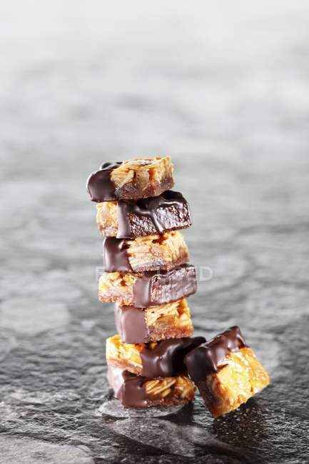 Closeup view of piled Florentines in chocolate — Stock Photo