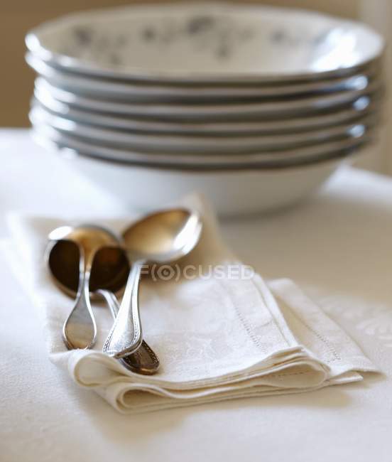 Closeup view of antique spoons with stacked bowls — Stock Photo