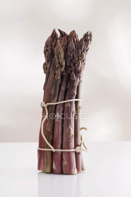 Bunch of purple asparagus — Stock Photo