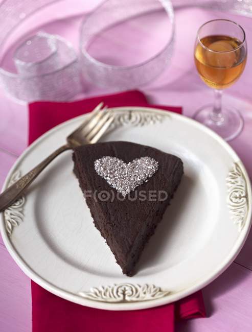 Chocolate Cake with Powdered Sugar Heart — Stock Photo
