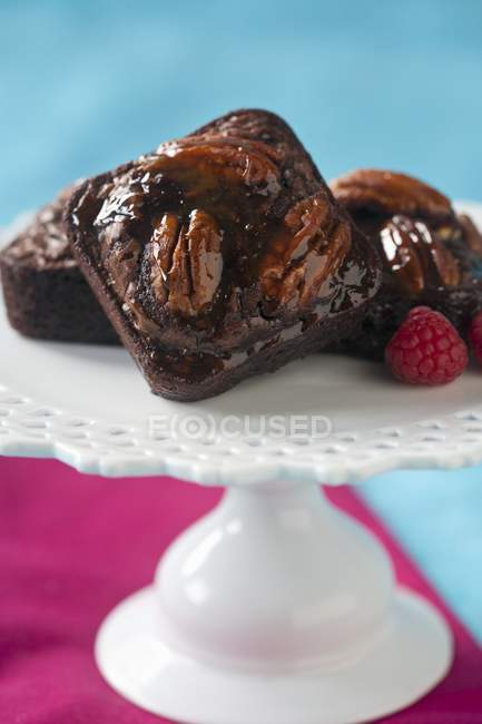 Pecan brownies serving on pedestal dish — Stock Photo