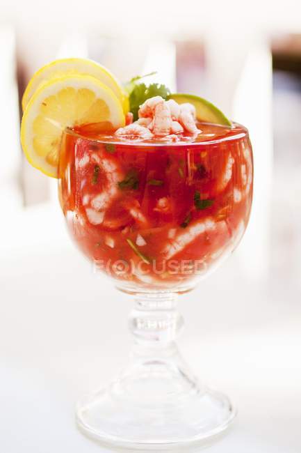 Closeup view of Mexican style shrimp cocktail in glass stem bowl — Stock Photo