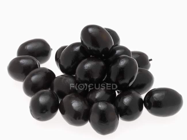 Куча чёрных оливок — стоковое фото