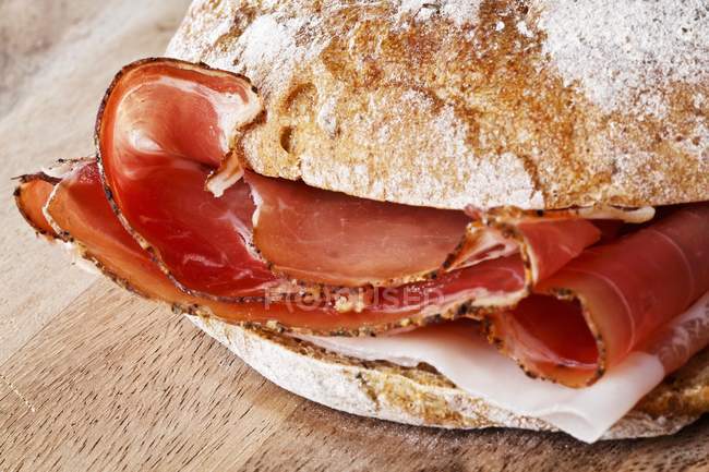 Ham roll on table — Stock Photo