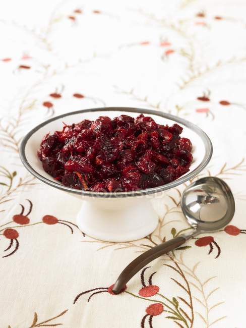 Closeup view of cranberry sauce with ladle — Stock Photo