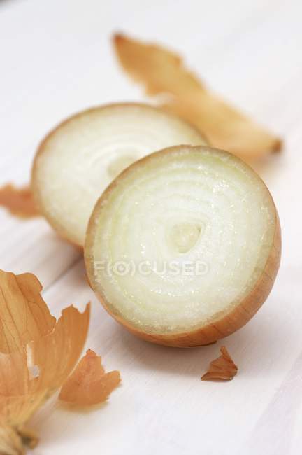 Onion halved into pieces — Stock Photo