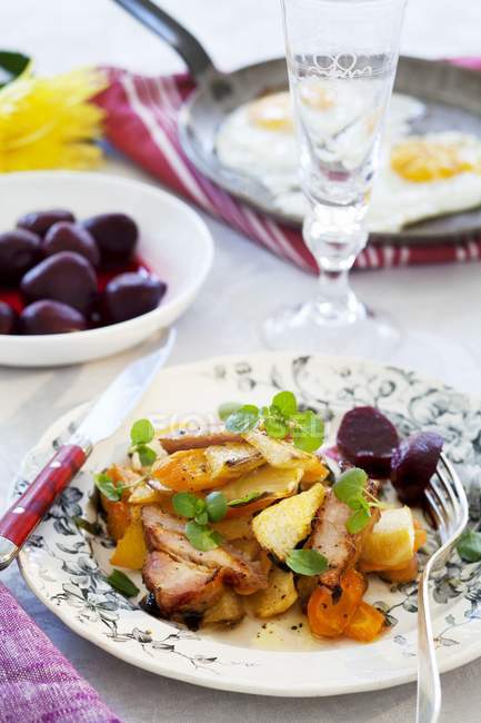 Smoked pork with root vegetables — Stock Photo