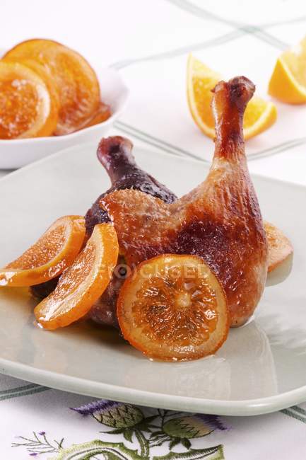 Roasted duck leg with oranges — Stock Photo