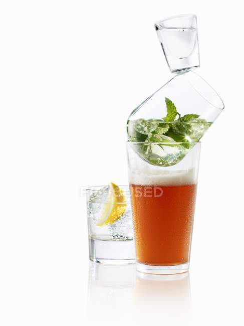 Glasses with beer, mint and vodka — Stock Photo