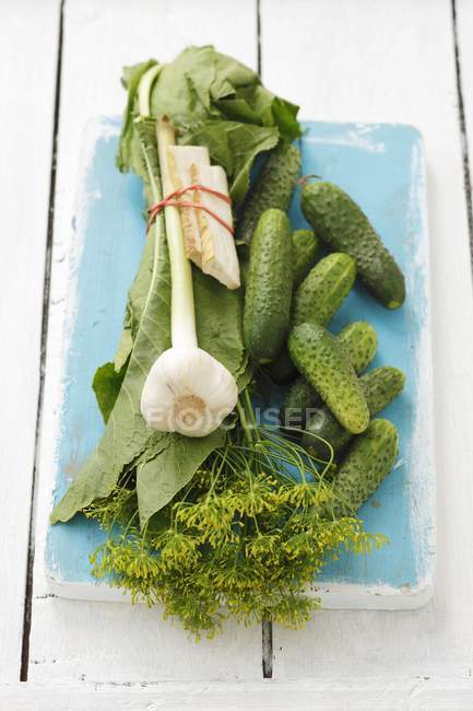 Cucumbers on wooden desk — Stock Photo