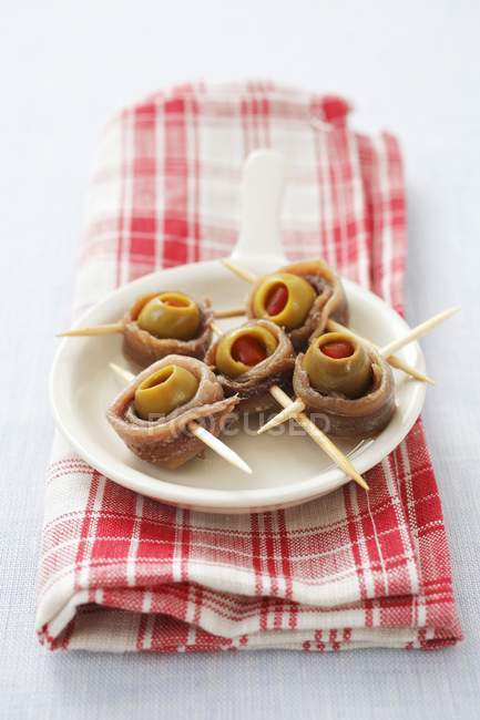 Sardine rolls with green olives — Stock Photo