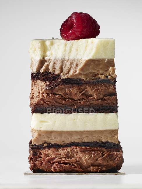 Chocolate cake topped with raspberry — Stock Photo