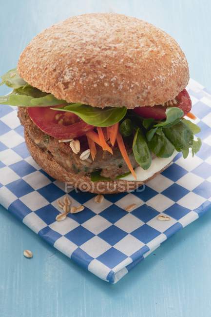 Burger with carrots and basil — Stock Photo