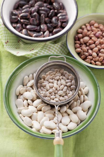 Colorful beans in bowls — Stock Photo