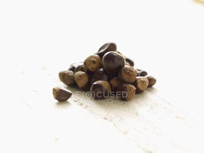 Guarana seeds in heap — Stock Photo
