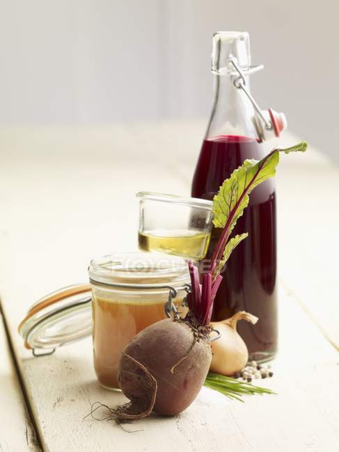 Ingredients for beetroot soup in jars and bottle — Stock Photo