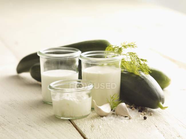 Ingredients for cold cucumber soup over wooden surface — Stock Photo