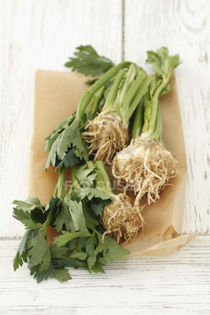 Young celeriac over wooden surface — Stock Photo