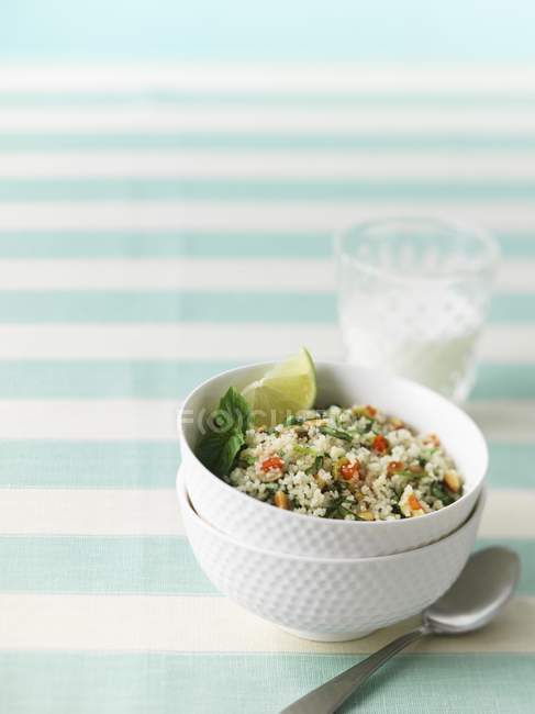 Couscous with basil ans lime slice — Stock Photo