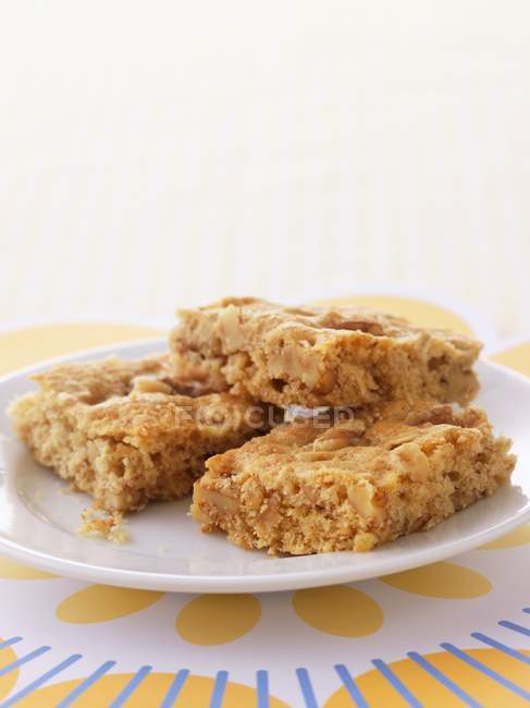 Closeup view of three Blondies pieces on plate — Stock Photo